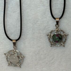 Silver Star Pendant Necklace Set of two. They come with a 20” cord necklace. NWT